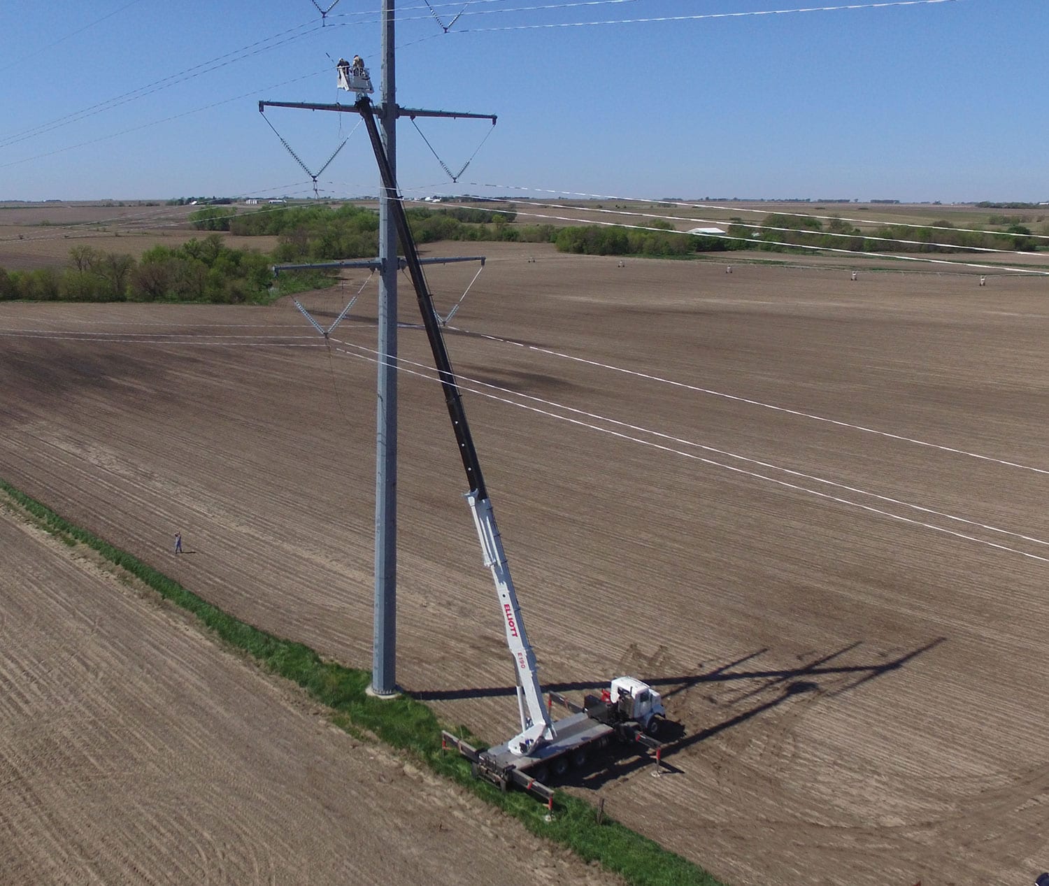 Elliott machine working on utility tower